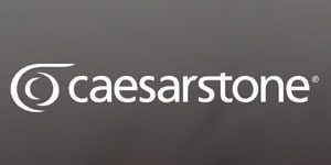 The image shows the Caesarsone logo with a swirl design on the left and the brand name "caesarstone" in white lowercase letters on a gray background.